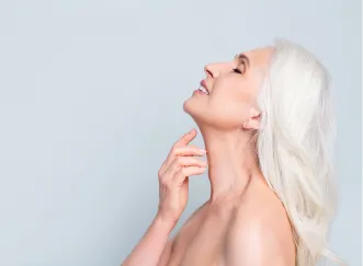 Elegant mature woman with smooth, lifted neck showing potential results of a neck lift and its value